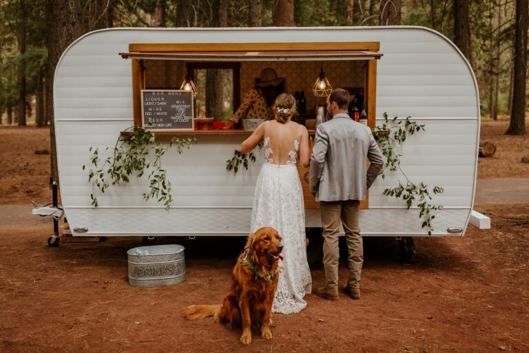 campground wedding central oregon bend outdoor adventure summer golden retriever dog swig rig drink bar trailer